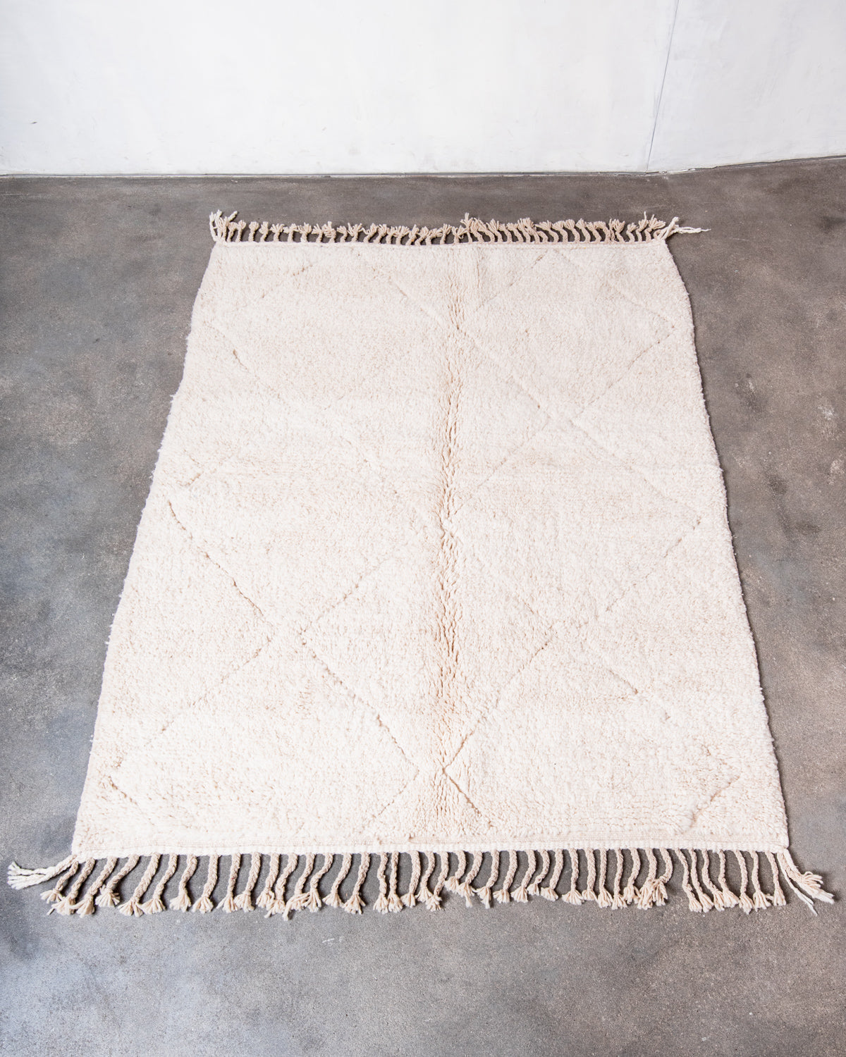 Modern, designer, handcrafted Berber rug from Morocco. Beniourain carpet with minimalist design, natural wool pile and a fluffy texture.
